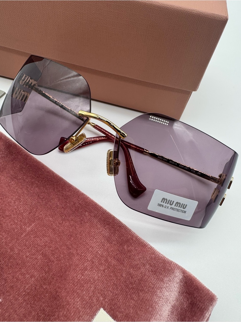 Miu Miu Purple Rimless Sunglasses with Gold Accents
